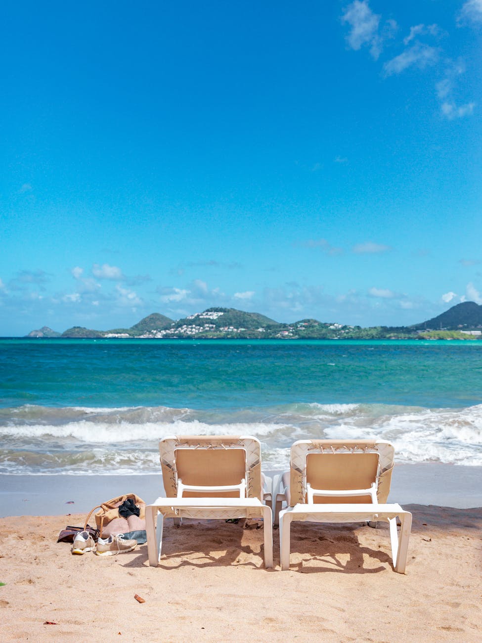 Sun loungers on a sandy beach in Castries, Saint Lucia