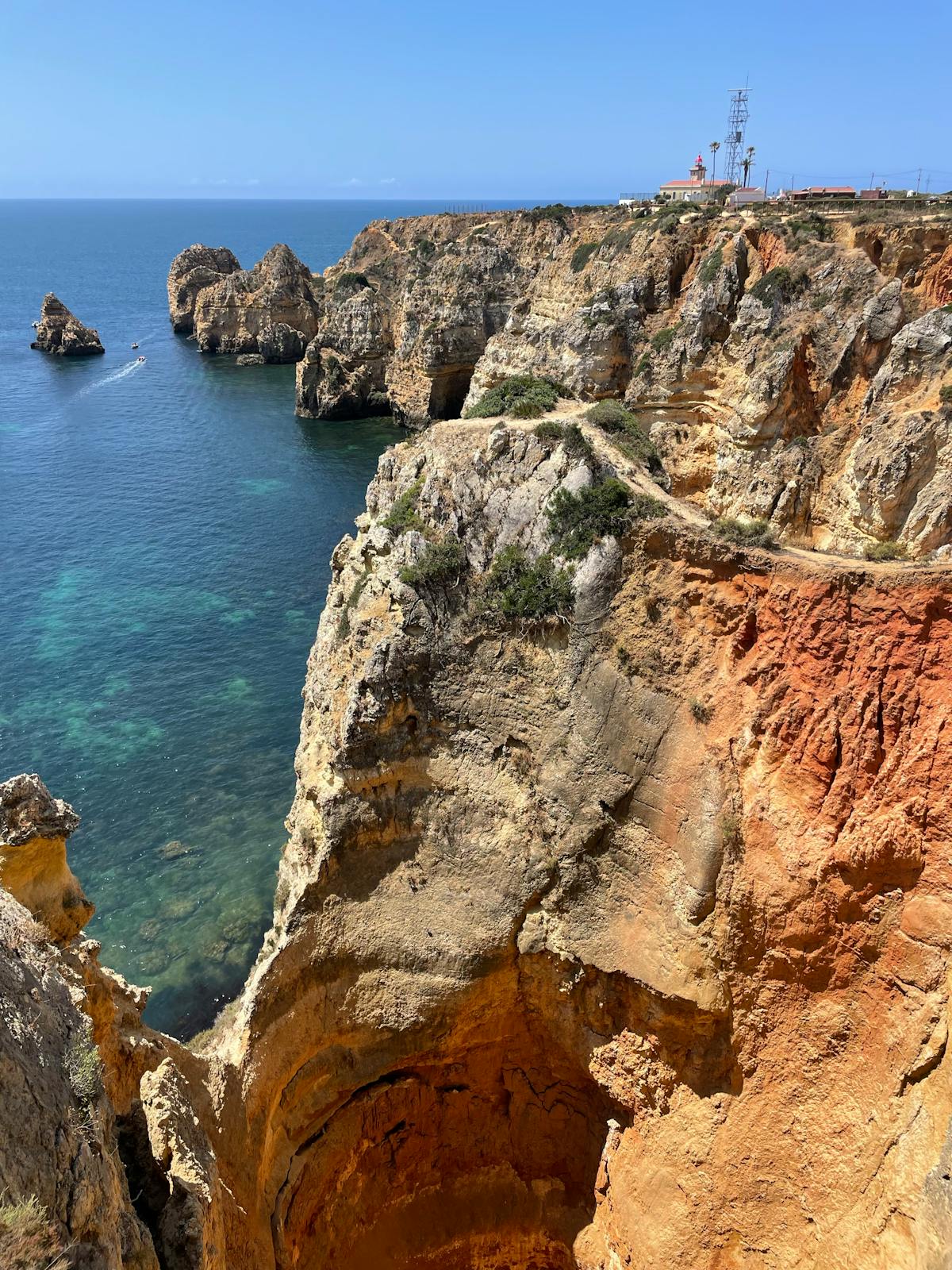 Limestone sea stacks and clear water at Ponta da Piedade near Lagos, Algarve