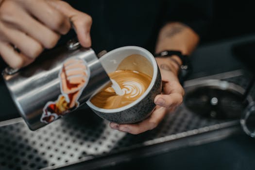 Market Lane Coffee Melbourne specialty roastery barista pouring milk latte art flat white