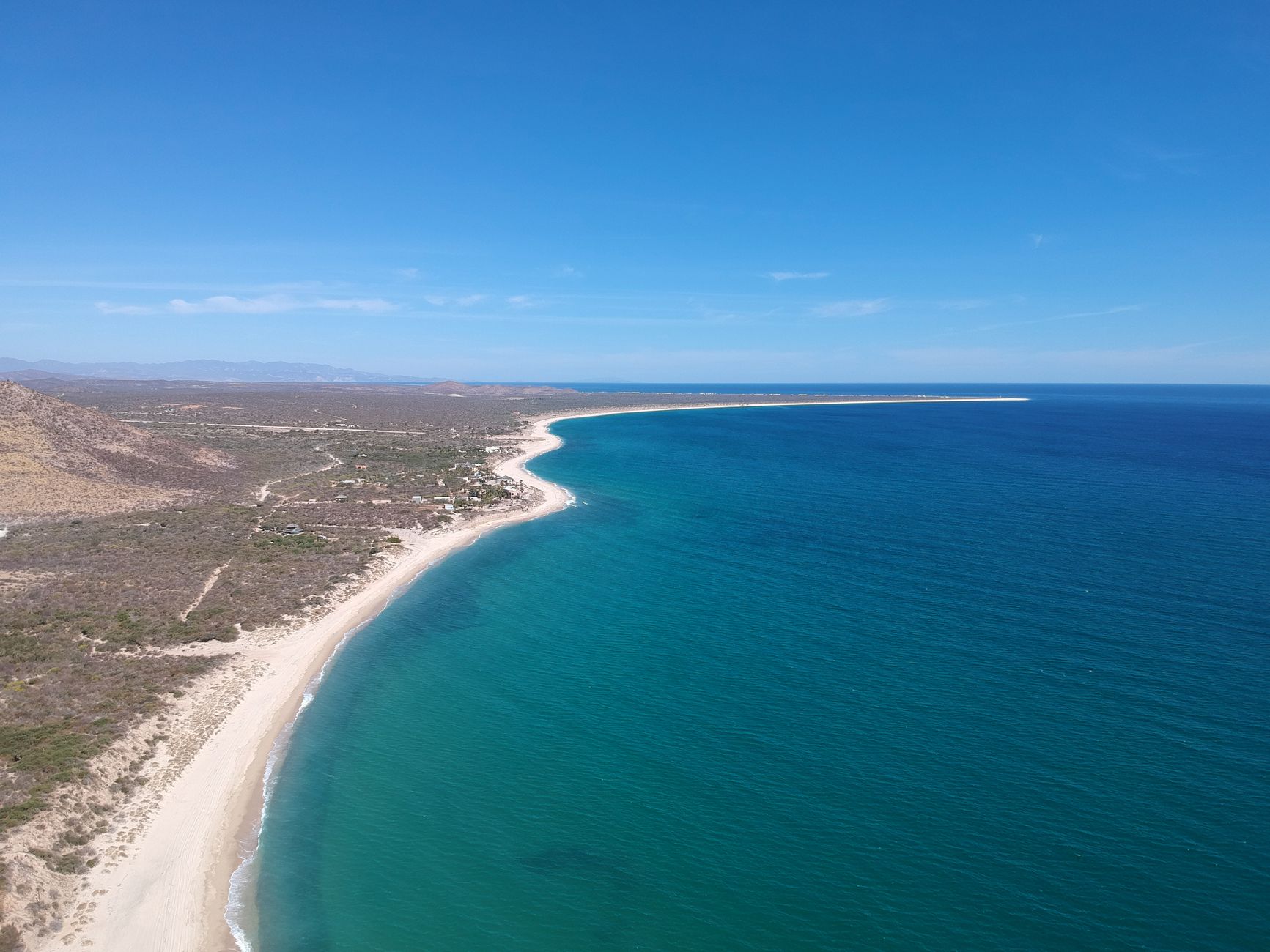Desert mountains meeting the turquoise Sea of Cortez on the Baja California Sur coast