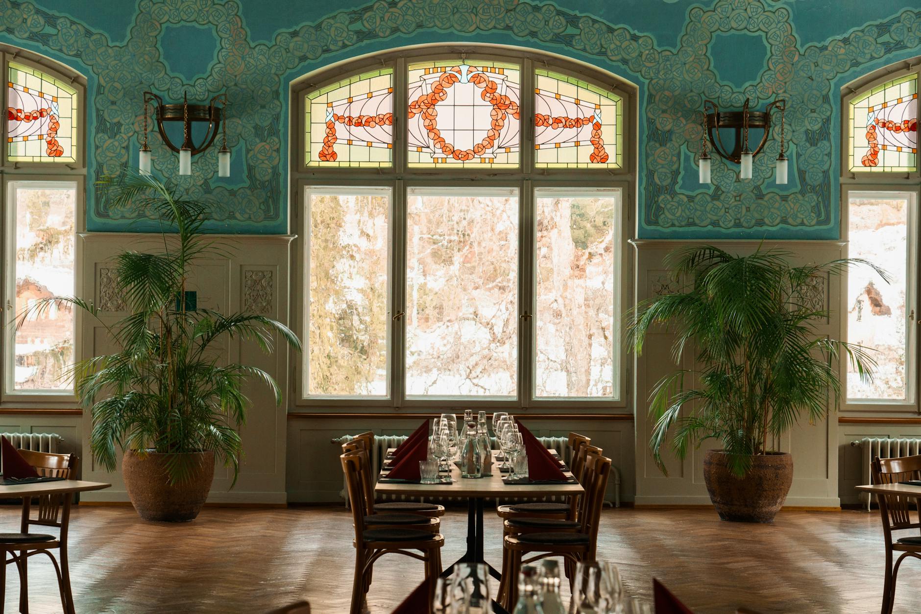 Art Nouveau café interior warm stained glass historic Belgium