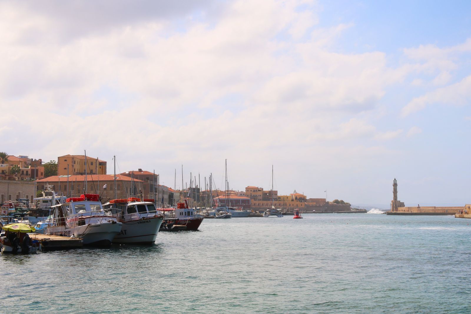 The Venetian harbour and lighthouse of Chania old town in Crete at golden hour