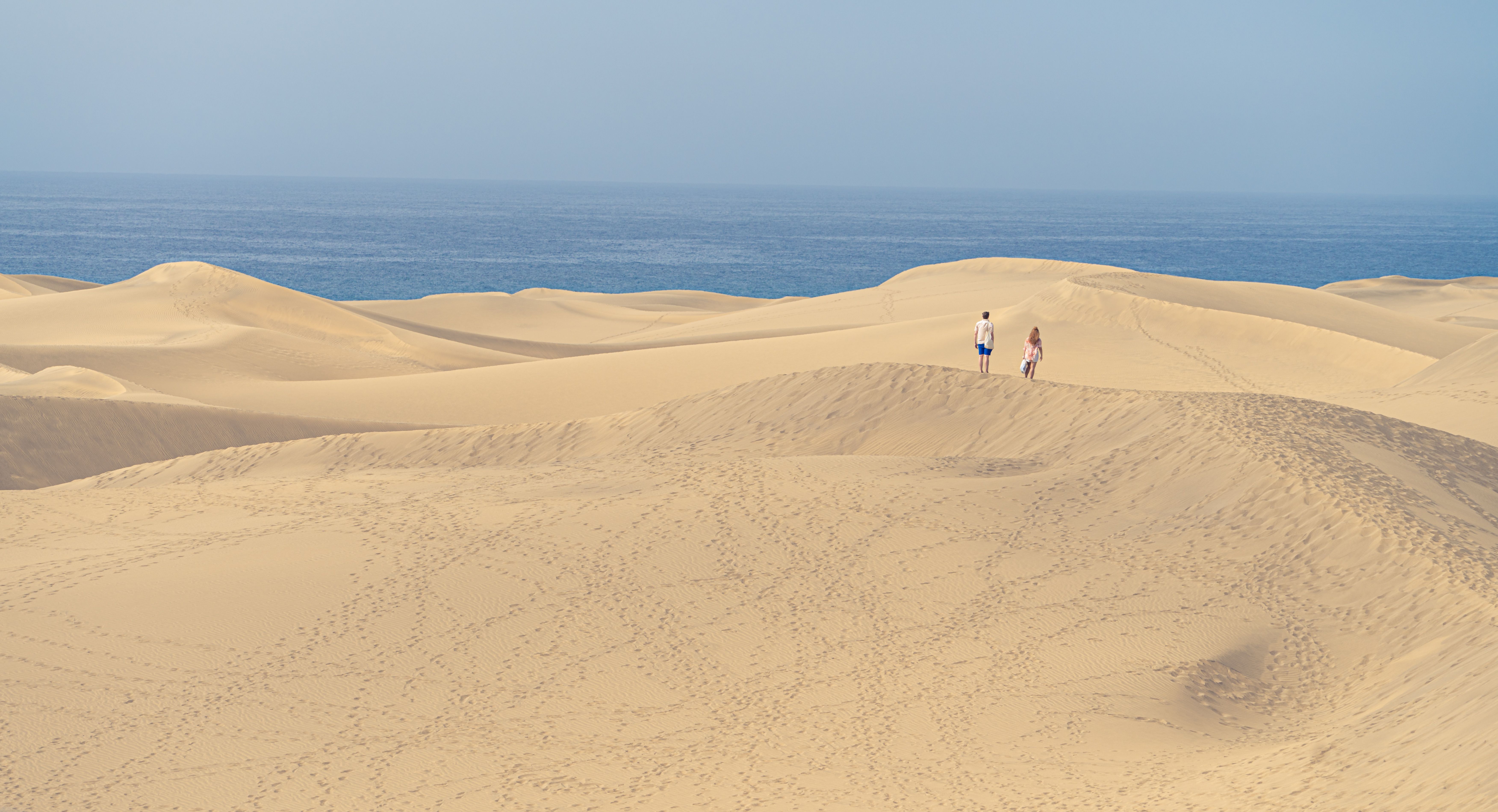 Maspalomas sand dunes meeting the sea on the south coast of Gran Canaria