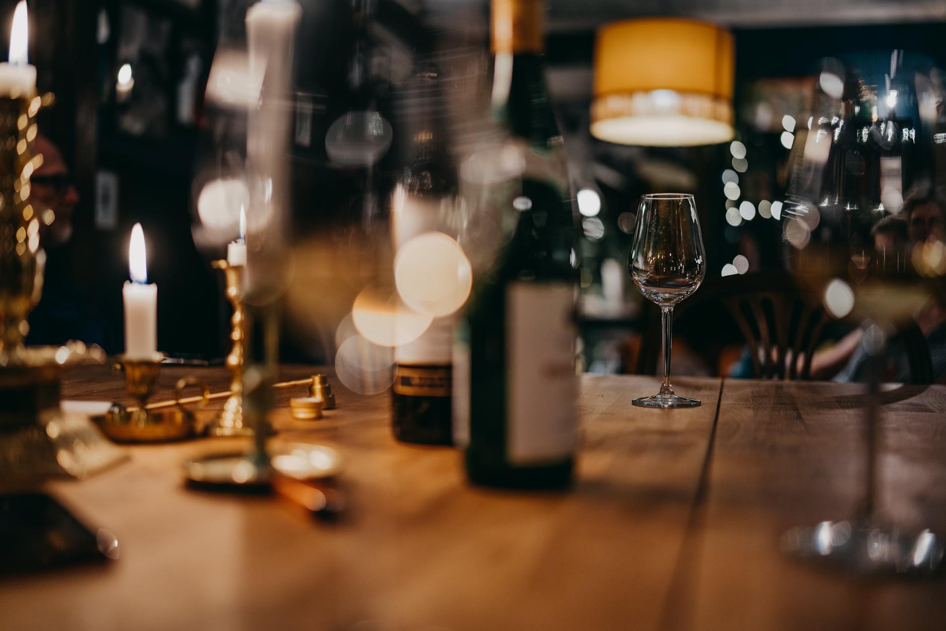 Cozy wine bar dark interior candles bottles Budapest