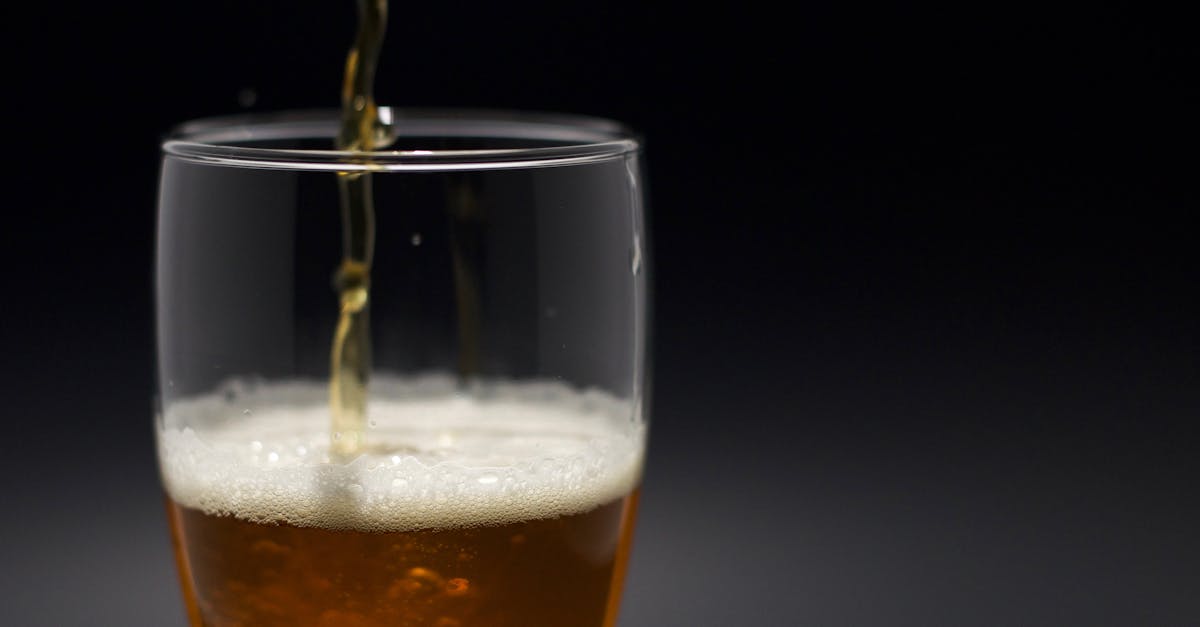 Craft beer being poured into a glass at a Pune brewpub
