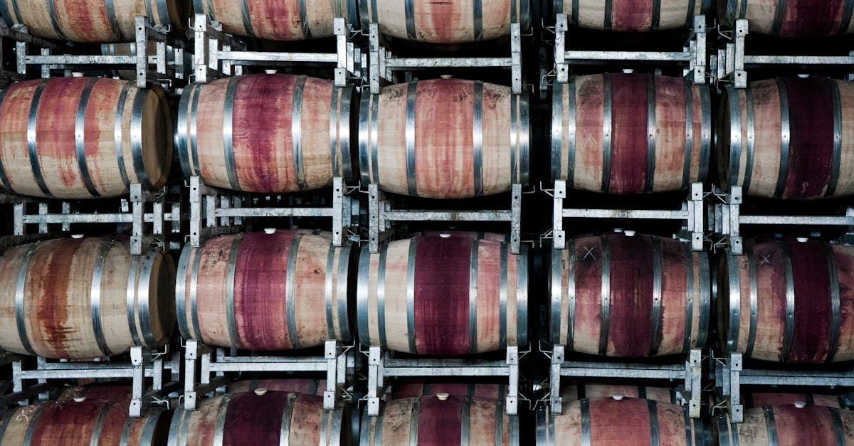 Stacked oak wine barrels ageing in an Indian winery cellar