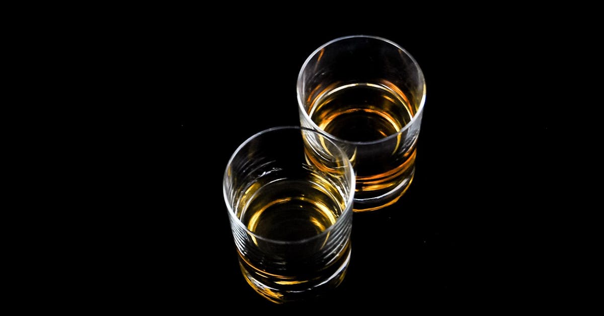 Two glasses of amber Indian single malt whisky