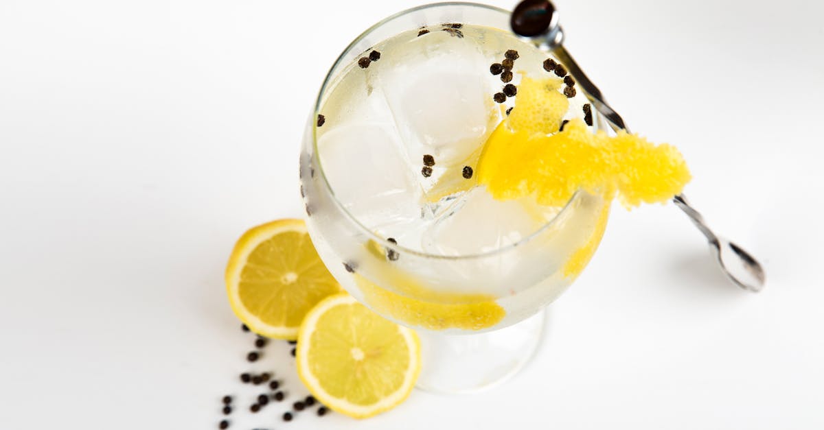 Indian craft gin and tonic garnished with citrus and peppercorns