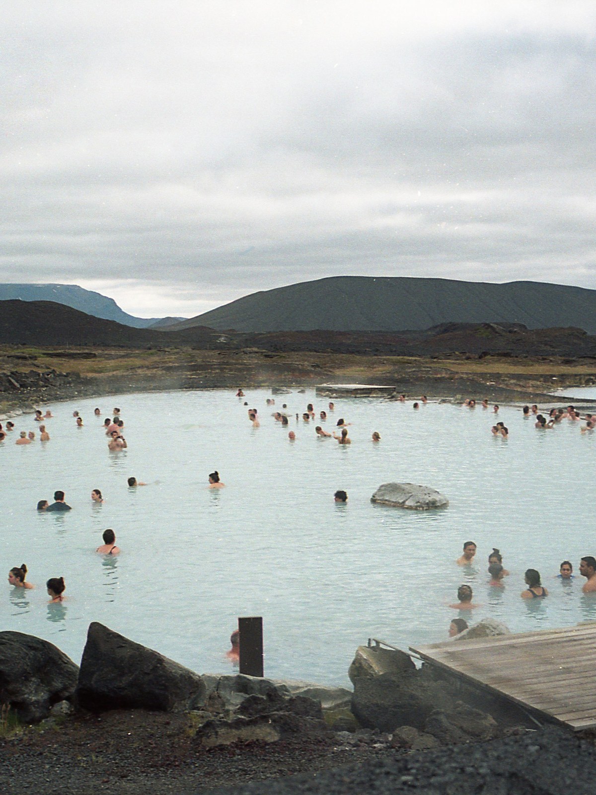 Cliffside geothermal infinity pool at GeoSea overlooking Skjalfandi Bay