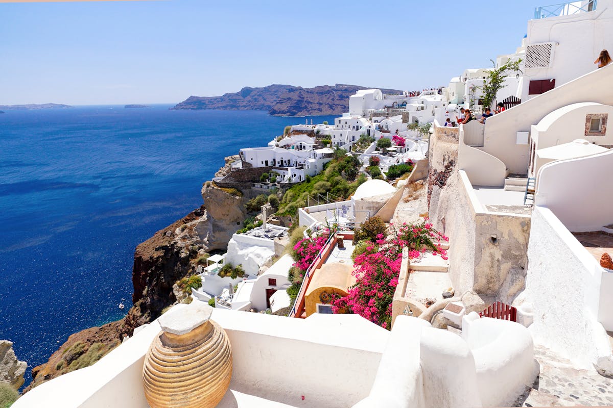 Whitewashed villages and the caldera rim along the Santorini coast