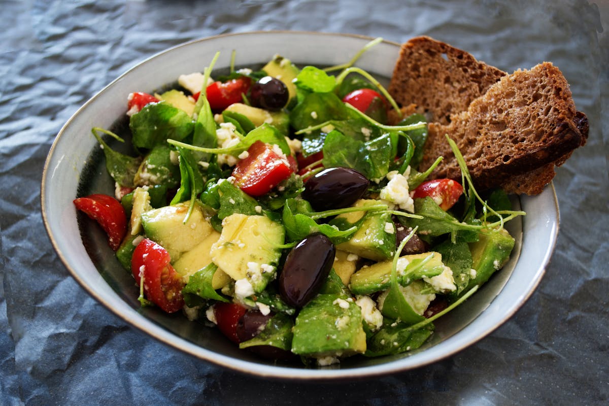 Greek salad with feta, olives, tomato and cucumber on a plate