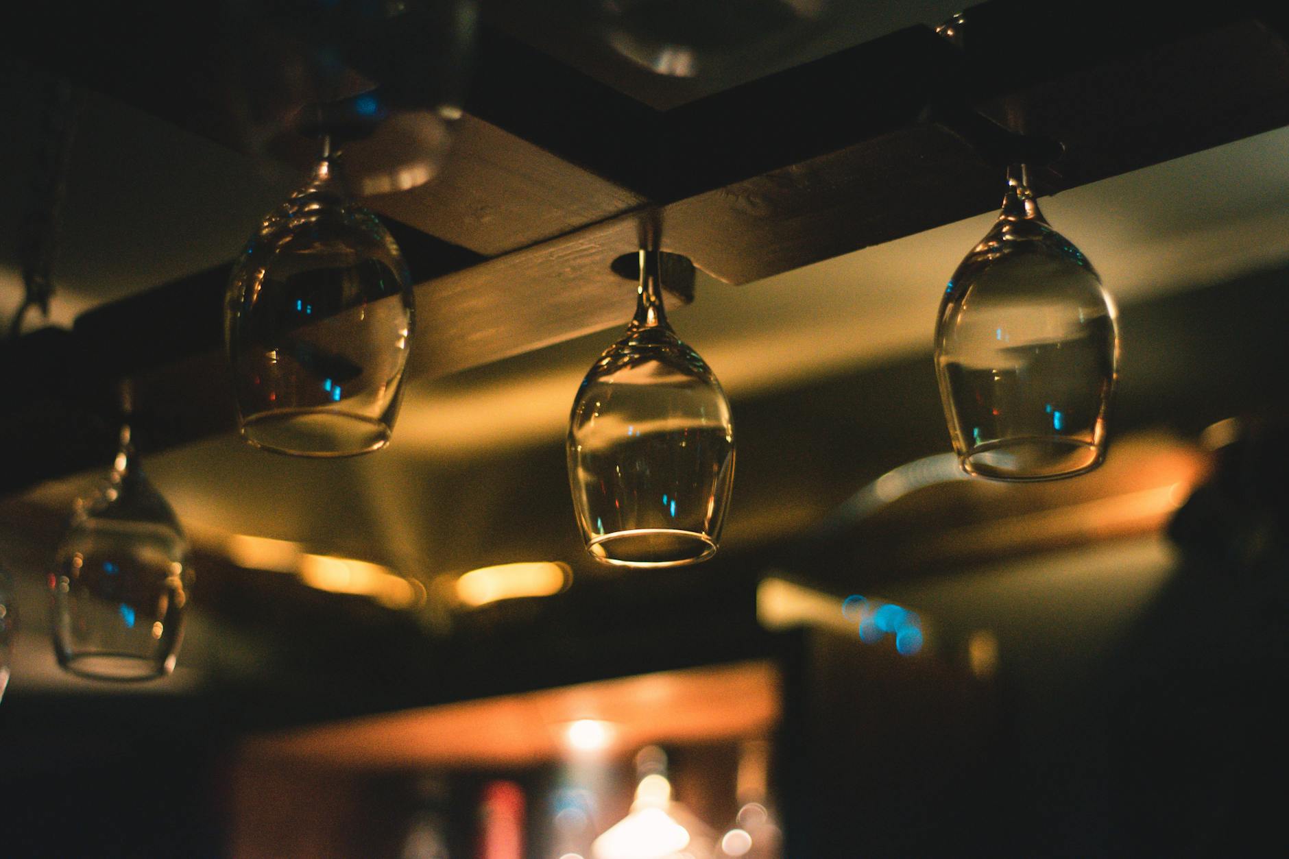 Wine bar interior with warm lighting and bottles