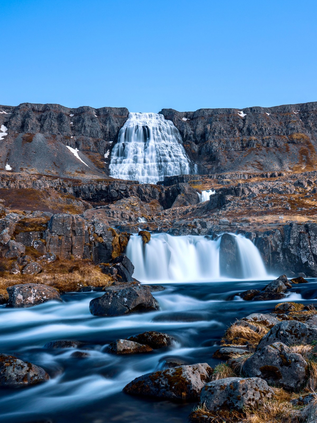 The tiered Dynjandi waterfall fanning out like a bridal veil down a mountainside