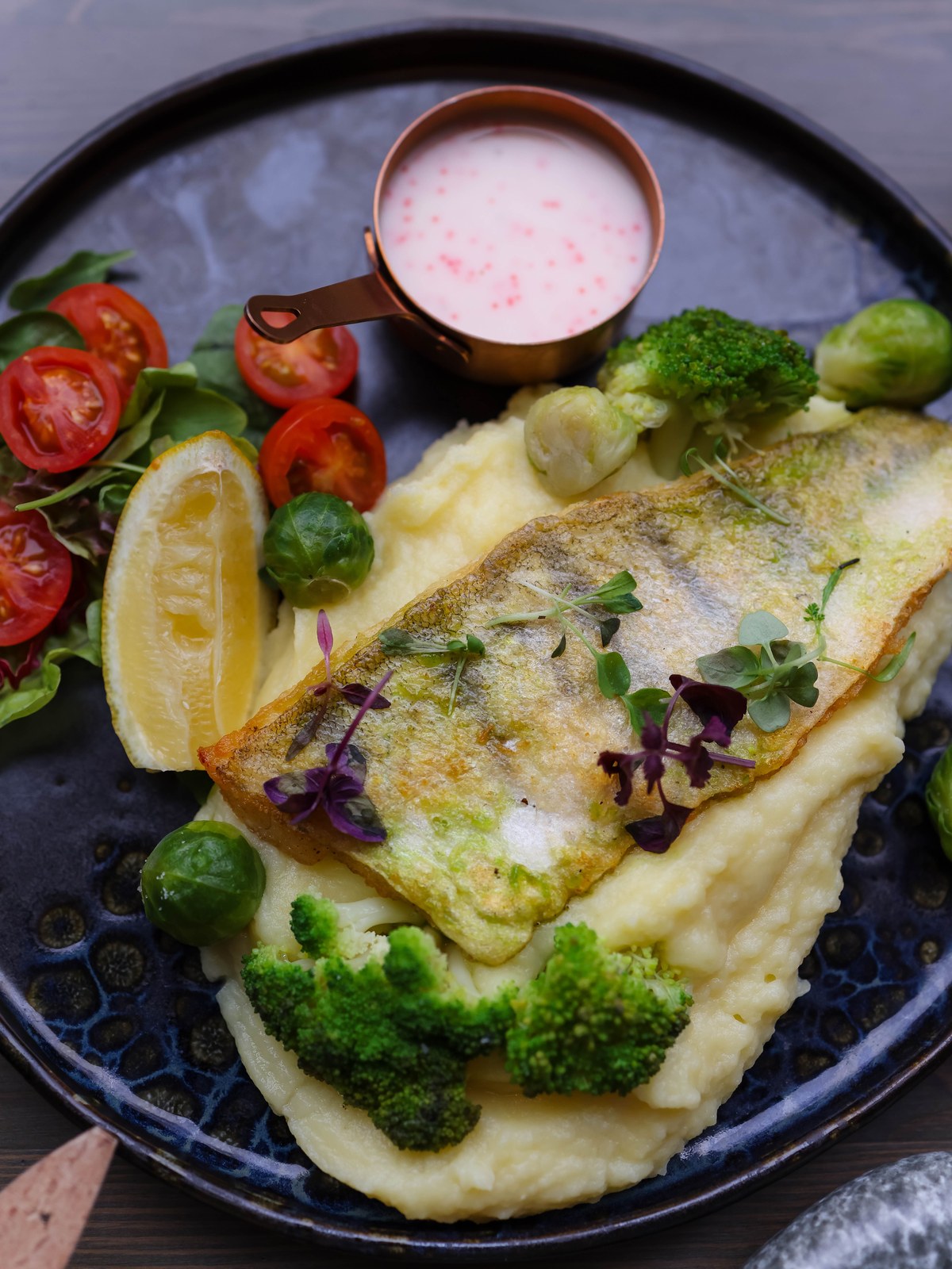 A plate of pan-fried Icelandic fish with potatoes