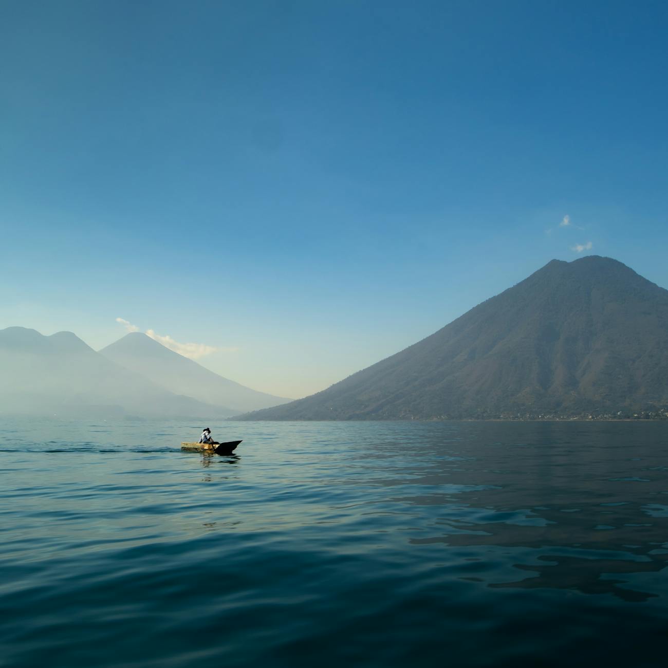 Lake Atitlán turquoise water with volcanoes in Guatemala